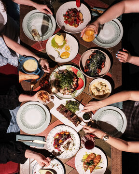 A Delicious Feast Shared Among Friends Gathered Around a Vibrant