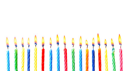 Colorful birthday candles in a horizontal row against a black background.  Each candle has a vibrant, multicolored striped design and a flickering flame