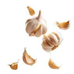 Fresh garlic bulbs and cloves, scattered against black background