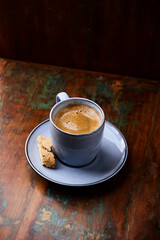 Cup of coffee on rustic wooden background. Soft focus. Copy space	