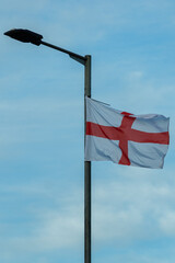 15 09 25 York. English Flag Flying on Pole Against Clear Blue Sky