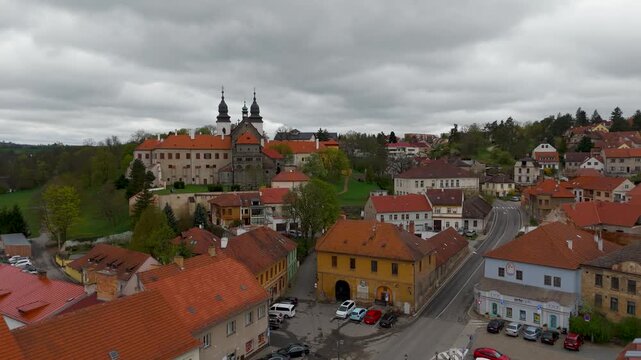 Drone view tracking over the UNESCO Jewish Quarter towards the historic 12th Century St. Procopius Basilica in Trebic, Czech Republic.