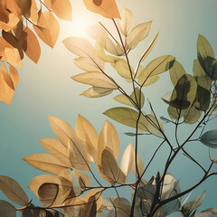 Softly lit autumn leaves with delicate branches against a hazy teal background creating a serene and tranquil natural atmosphere