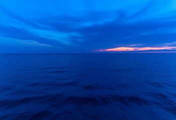 Obraz premium A tranquil ocean scene at twilight, deep blue hues dominating the sky and water, water, design