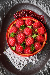 Indulge in a delicious Raspberry Tart beautifully garnished and presented