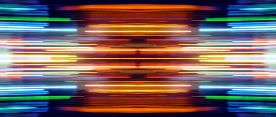 Motion of colorful trail lights. Abstract Rainbow light trails on the dark background
