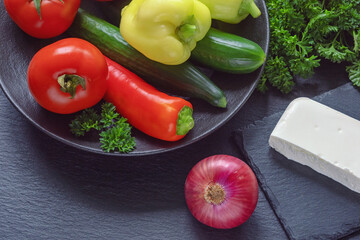 Balkan cuisine. Colorful vegetables and white cheese for Shopska Salad, traditional dish of the Balkan. Copy space