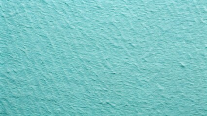 Close up textured abstract background of gentle aqua blue water ripples and waves