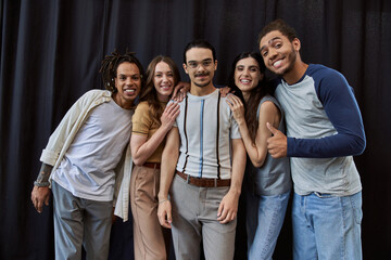 Stylish young friends celebrate friendship and fashion in a cozy indoor setting