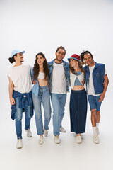 Naklejka premium Friends showcase joy and style in matching denim outfits at a fun photoshoot