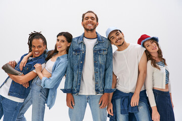 Stylish young friends celebrating fashion and fun in a vibrant studio setting