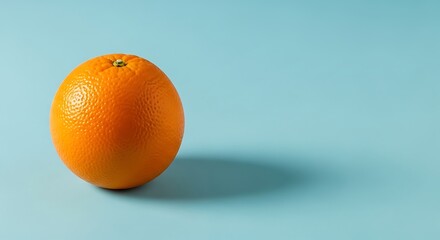 Vibrant orange fruit isolated against a cool blue backdrop for fresh summer vibes and healthy living inspiration