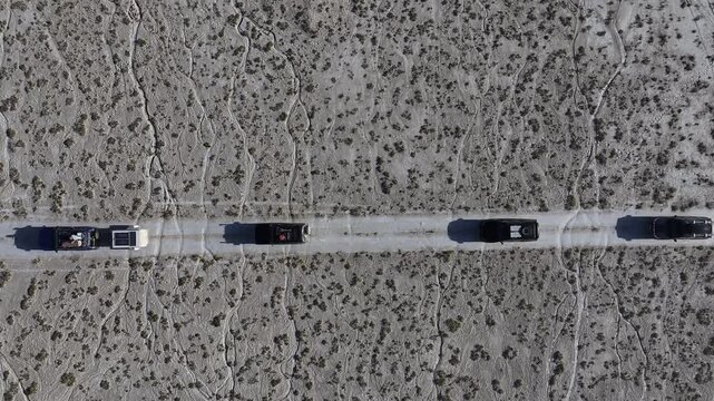 Kazakhstan, Ustyurt plateau. Cars drive through the desert.