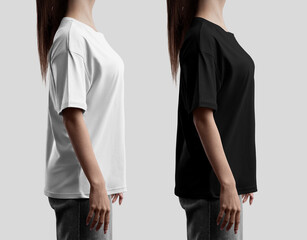 Template of white, black oversized t-shirt on a girl in gray jeans, close-up, side view, for design, branding, pattern, print. Set