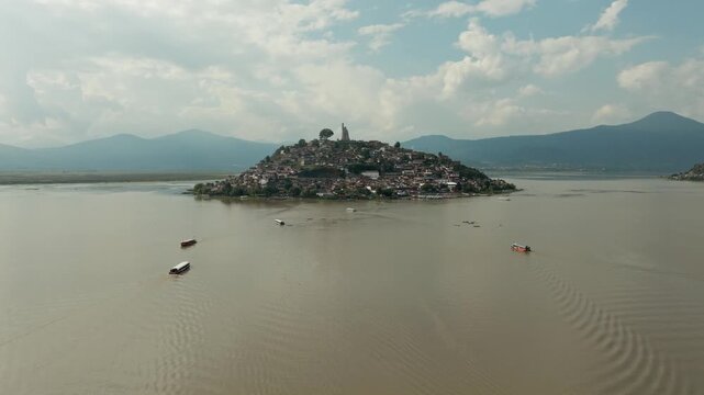 DOLLY IN DRONE SHOT OF JANITZIO ISLAND AT PATZCUARO LAKE