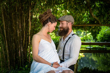 Photography of a lovely young couple expected a baby