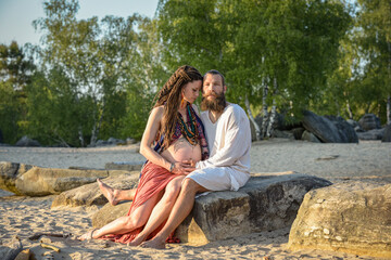Photography of a lovely young couple expected a baby