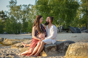 Photography of a lovely young couple expected a baby