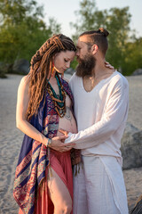 Photography of a lovely young couple expected a baby