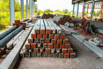 Construction site with cement factory, mixer trucks, and concrete silos
