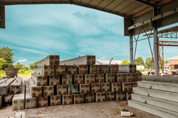 Construction site with cement factory, mixer trucks, and concrete silos