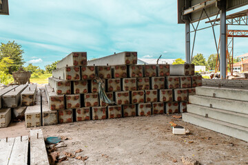 Construction site with cement factory, mixer trucks, and concrete silos