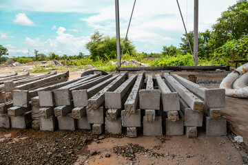 Construction site with cement factory, mixer trucks, and concrete silos