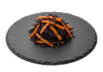 A dark gray slate platter holds a colorful mix of black seaweed and orange carrot strips.
