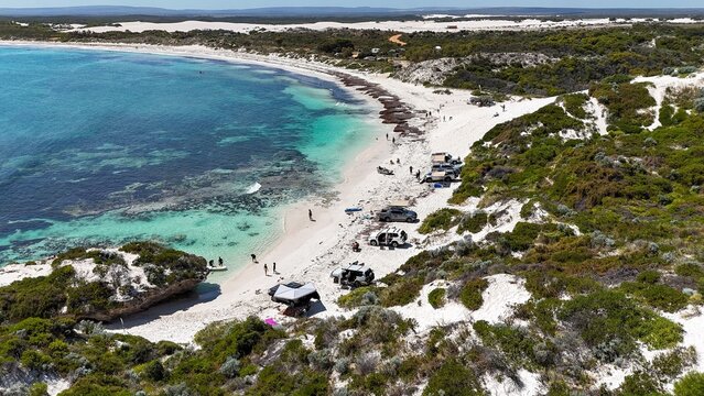 Aerial view of a picturesque beach with turquoise waters.