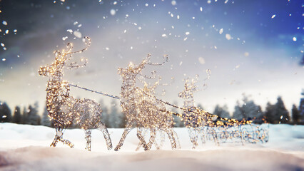 Snowman with Christmas lights decoration in winter scene with falling snow
