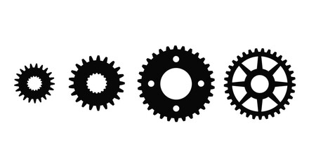 Four interlocking gears in a silhouette arrangement