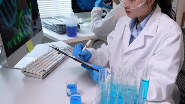 Scientist analyzing dna structure on computer screen