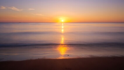 Naklejka premium Serene Ocean Sunset with Golden Sunlight Reflections – Calm Water, Minimal Clouds, Tranquil Seascape, Wide Horizon, Warm Tones