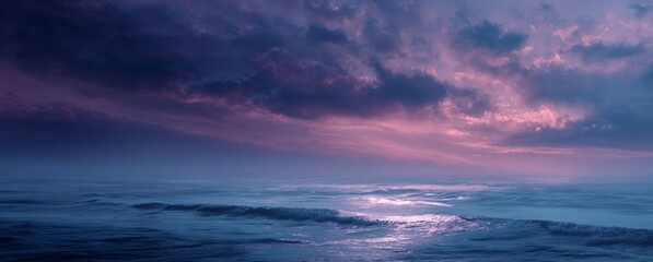 Obraz premium Ocean Sunset with Pink Clouds and Gentle Waves