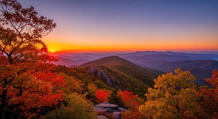 Fototapeta premium Mountain sunset amidst colorful autumn foliage with distant blue ridgelines