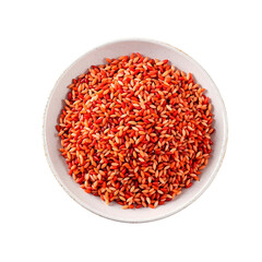 A top-down view of a white ceramic bowl filled with uncooked organic red rice, isolated on a clean white background for culinary concepts