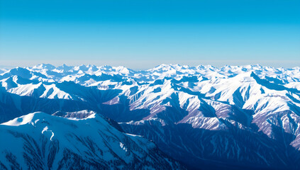 Obraz premium Majestic Snow-Capped Mountain Ranges Under Clear Blue Sky