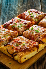 Pizza al metro margherita on wooden table