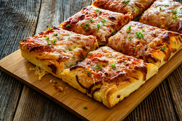 Pizza al metro margherita on wooden table