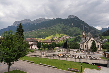 Moena Cemetery With Church And Mountain Background - Italy