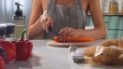 Woman Preparing Fresh Vegetables in a Modern Kitchen Space