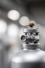 Closeup of a silver pressure tank with gauge and valve, symbolizing control, safety, and industrial precision. Perfect for engineering, manufacturing, or tech contexts.