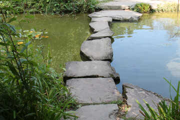 A Set of Stepping Stones Across an Ornamental Pond.