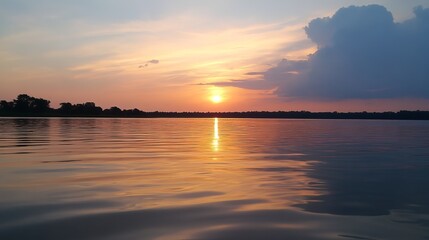 Obraz premium Sunset over a calm river