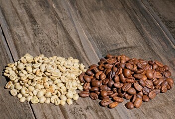 Raw and roasted piles of coffee beans