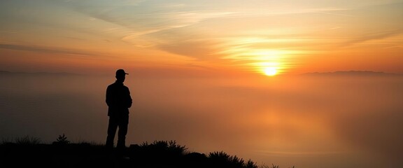 Silhouette of a contemplative figure at sunset over a misty lake,  digital art, nature