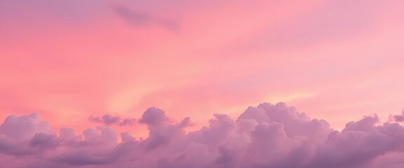 Obraz premium Soft pastel pink twilight sky, fluffy clouds, colorful sunset glow, daybreak, atmosphere