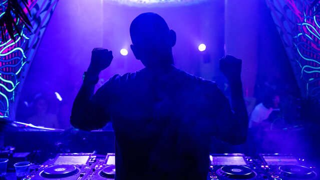 Dj dancing while playing music