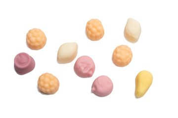 Top view of assorted pastel candies in different shapes and colors on a transparent background in PNG format. Bright and playful arrangement.