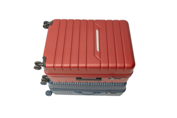Top view of a red suitcase stacked on a blue suitcase on a transparent background in PNG format. Modern travel luggage design.